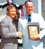 Mickey Mantle shakes hands with Bowie Kuhn at Mickey's induction into the Baseball Hall of Fame
