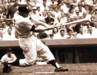 Mickey Mantle's classic right-handed home run power swing, showing Mickey smashing a long right-handed home run at Yankee Stadium in New York